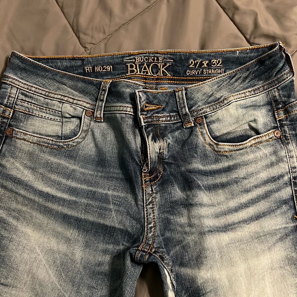Buckle blacks jeans.